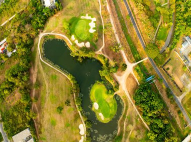 Aerial view drone shot of beautiful green golf field at Phuket island Thailand,Wide angle Top view golf course