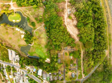 Aerial view drone shot of beautiful green golf field at Phuket island Thailand,Wide angle Top view golf course