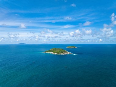 Aerial view of a blue sea surface water texture background,Sun reflections over ocean, Aerial flying drone view Waves water surface texture on sunny tropical ocean in Phuket island Thailand