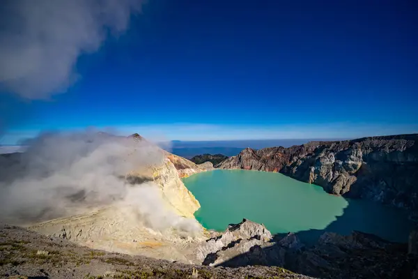 stock image Aerial view Kawah Ijen volcano with turquoise sulfur water lake at sunrise.Amazing nature landscape view at East Java, Indonesia. Natural landscape background