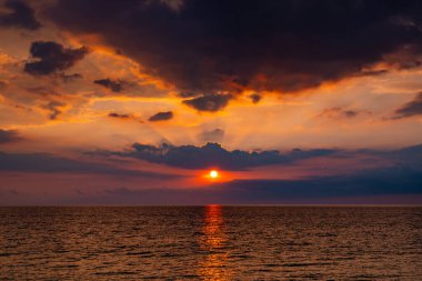 Landscape Long exposure of majestic clouds in the sky sunset or sunrise over sea with reflection in the tropical sea.Beautiful cloudscape scenery.Amazing light of nature Landscape nature background