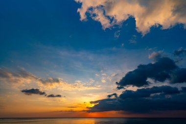 Landscape Long exposure of majestic clouds in the sky sunset or sunrise over sea with reflection in the tropical sea.Beautiful cloudscape scenery.Amazing light of nature Landscape nature background