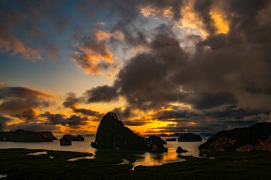 Landscape Long exposure of majestic clouds in the sky sunset or sunrise over sea with reflection in the tropical sea.Beautiful cloudscape scenery.Amazing light of nature Landscape nature background