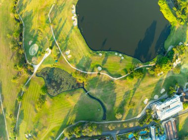 Aerial view drone shot of beautiful green golf field at Phuket island Thailand,Wide angle Top view golf course