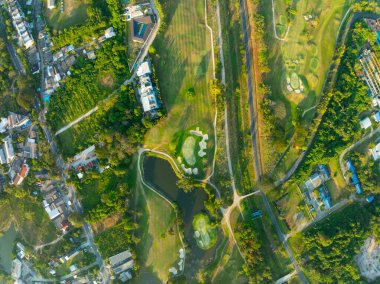 Aerial view drone shot of beautiful green golf field at Phuket island Thailand,Wide angle Top view golf course