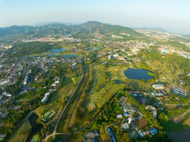Aerial view drone shot of beautiful green golf field at Phuket island Thailand,Wide angle Top view golf course