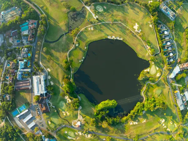 Aerial view drone shot of beautiful green golf field at Phuket island Thailand,Wide angle Top view golf course