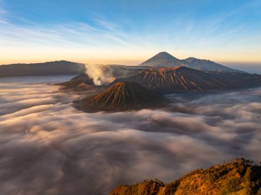 Aerial view Mountains at Bromo volcano during sunrise sky,Beautiful Mountains Penanjakan in Bromo Tengger Semeru National Park,East Java,Indonesia.Nature landscape background clipart