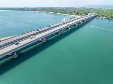 Aerial view of Sarasin bridge road transportation background concept The bridge is a between Phang Nga and Phuket island Thailand The bridge is the most important in making business and transportation clipart