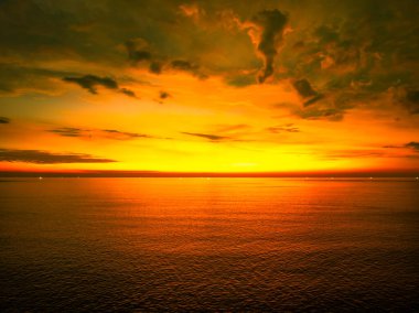 Beautiful Light Sunset or sunrise over sea,Colorful dramatic majestic scenery sunset Sky, Amazing clouds and small waves in the ocean, Wonderful light cloud background clipart