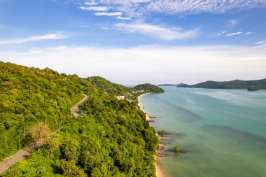 Aerial view of a blue sea surface water texture background,Sun reflections over ocean, Aerial flying drone view Waves water surface texture on sunny tropical ocean in Phuket island Thailand clipart