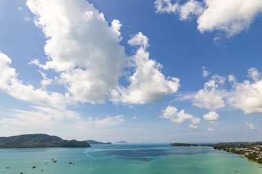 Aerial view of a blue sea surface water texture background,Sun reflections over ocean, Aerial flying drone view Waves water surface texture on sunny tropical ocean in Phuket island Thailand