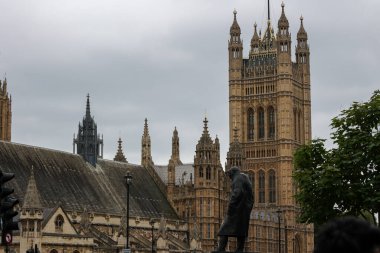 Statue of Winston Churchill, bronze sculpture located in Parliament Square, in front of the Palace of Westminster. clipart