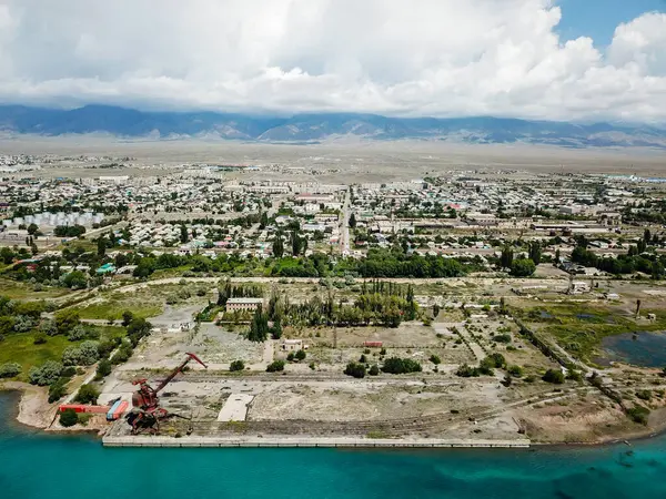 stock image Aerial view of abandoned port with rusted quay cranes on a lake shore