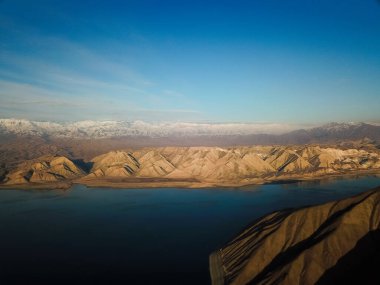 Aerial view of Toktogul water reservoir in Kyrgyzstan clipart