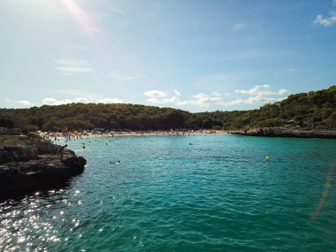 Aerial view of Cala Llombards (Santanyi) beach in Mallorca Island in Spain during summer sunny day clipart