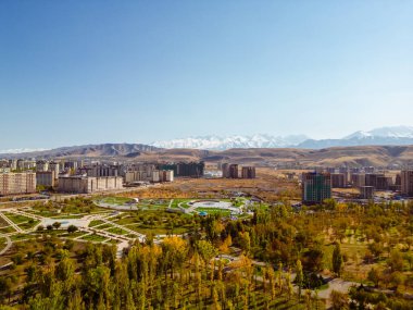 Panoramic aerial view of Victory park in Bishkek city Kyrgyzstan and Kyrgyzstan and Azerbaijan friendship park in Bishkek city clipart