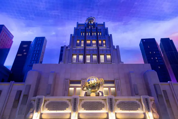 stock image Abu Dhabi, UAE - April 24, 2024: View of the iconic Daily Planet building at Warner Bros World in Abu Dhabi, featuring an illuminated facade with surrounding skyscrapers in a themed indoor environment