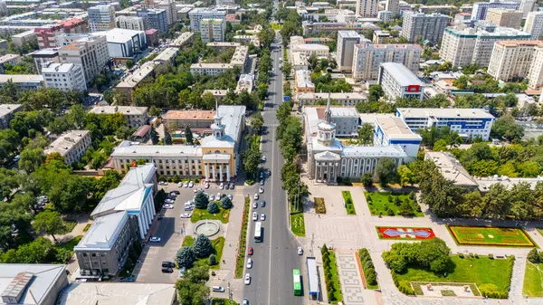 stock image Bishkek, Kyrgyzstan - July 30, 2024: Aerial view of Bishkek City Hall and International University of Kyrgyzstan with surrounding area and streets