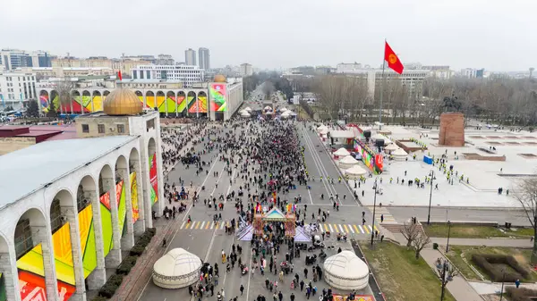 stock image Bishkek, Kyrgyzstan - March 21, 2024: Aerial view of people celebrating Nowruz on central square of Bishkek city. Nowrus is a holiday of the arrival of spring and the New Year