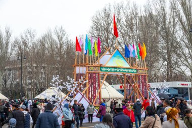 Bishkek, Kyrgyzstan - March 21, 2024: Kyrgyz yurts and ornaments during Nowruz holiday on central square of Bishkek city. Nowrus is a holiday of the arrival of spring and the New Year clipart