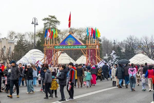 stock image Bishkek, Kyrgyzstan - March 21, 2024: People celebrating Nowruz on central square of Bishkek city. Nowrus is a holiday of the arrival of spring and the New Year according to the astronomical solar calendar