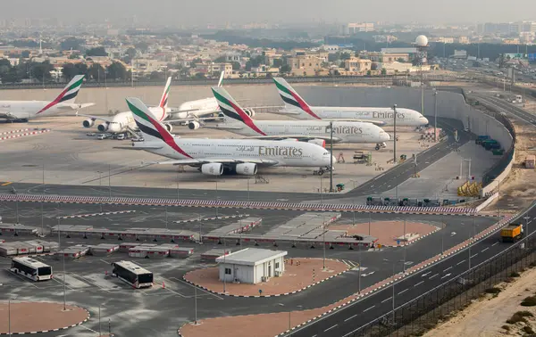 stock image Dubai, UAE - May 14, 2024: Emirates airplanes parked at Dubai International Airport