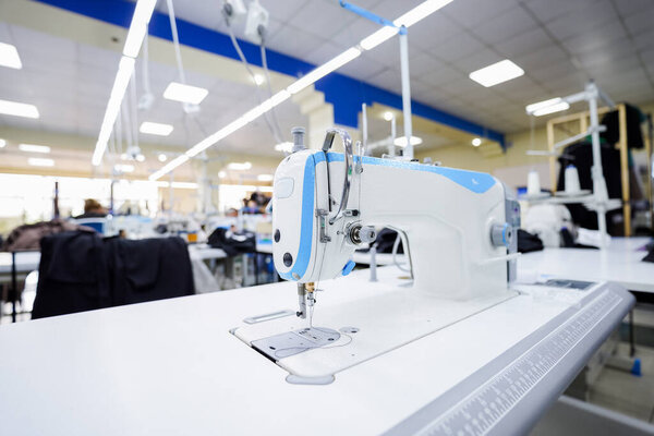 Close up of white electric sewing machine