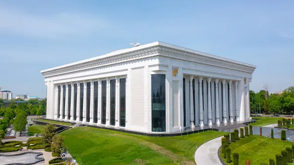 stock image Tashkent, Uzbekistan - May 13, 2023: Palace of International Forums in Uzbekistan, featuring its grand neoclassical architecture with tall columns and intricate details