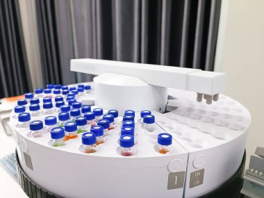 Automated laboratory sample handling system with vials in gas chromatography autosampler carousel. Modern scientific research and pharmaceutical testing equipment for chemical analysis