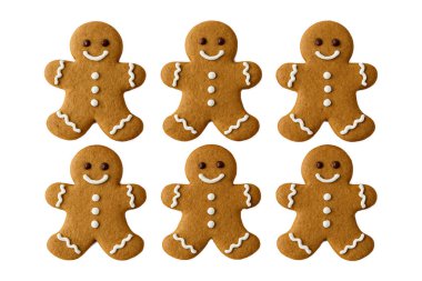 Beyaz arka planda izole edilmiş altı tane gülümseyen zencefilli kurabiye Noel bayramı tatlısı kış kutlamaları ve mevsimlik dekorasyon için geleneksel ev yapımı tatlılar fırın ve şenlikli mutfak temaları için mükemmel.