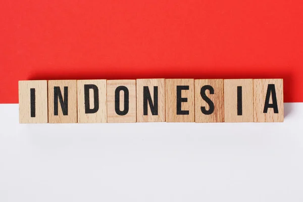 Iscrizione Indonesia Sullo Sfondo Dei Colori Della Bandiera Indonesiana — Foto Stock