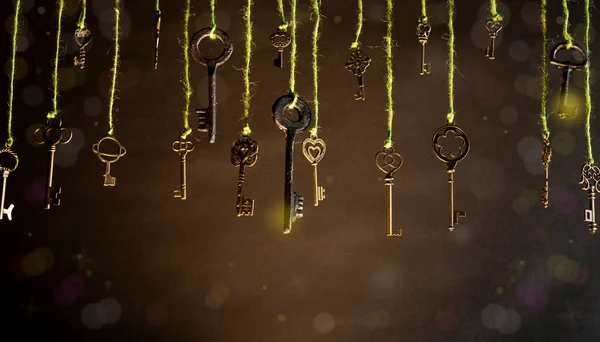 Stock image Concept of knowledge with vintage keys hanging from top on dark room background.