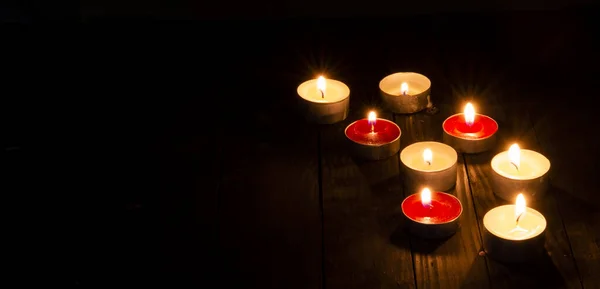 Set Candles Lightening Dark Table Background — Stock Photo, Image
