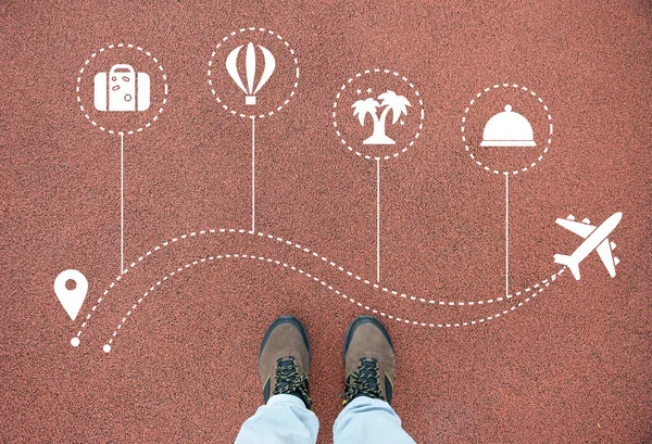 Traveling plane icons with solo traveler shoes closeup.