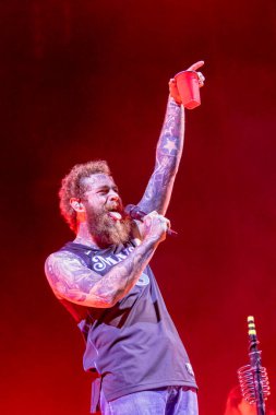 Post Malone and his band perform at the Bonnaroo music festival