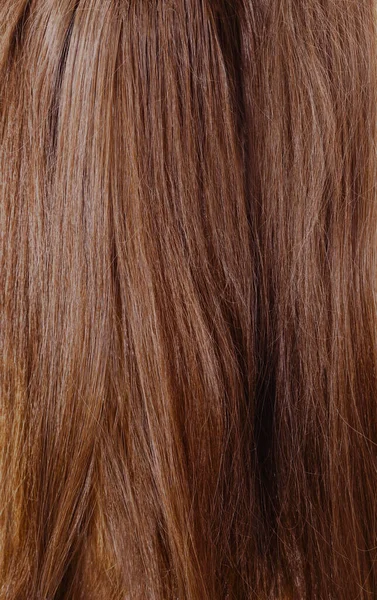 ブラウンは背景を形成する長い髪の未結合 — ストック写真