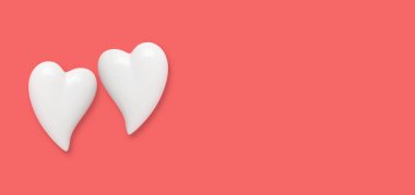 Two white hearts on a red background with copy space. Simple concept for Valentines day holiday. High quality photo