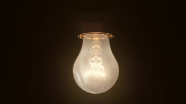 Slow Motion Turning Incandescent Light Bulb Dark Background Light Bulb — Vídeo de Stock