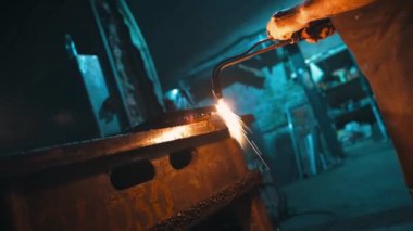 Flame cutting of metal. Cutting metal with a gas cutter. An employee cuts a metal blank with a gas cutter. High quality 4k footage