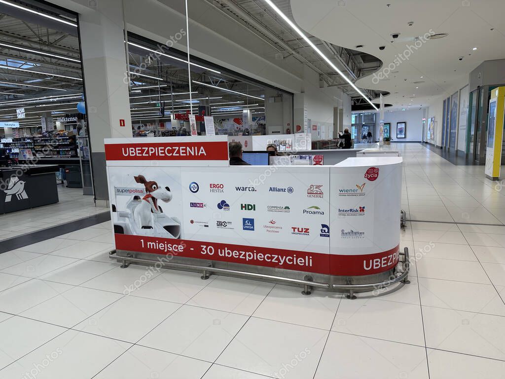 Warsaw, Poland - May 22, 2025: Insurance counter located in a contemporary shopping mall, showcasing various brand logos and a welcoming atmosphere