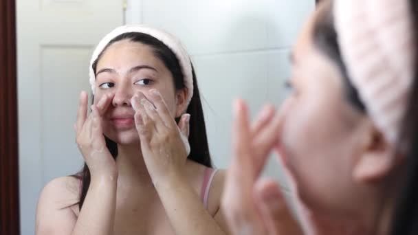 Young Woman Mirror Using Rose Quartz Facial Roller Her Cheek — Stock Video