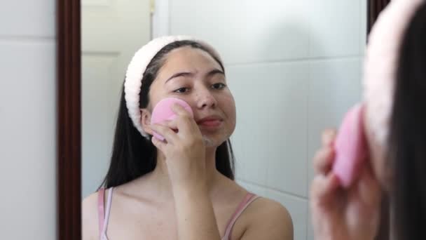 Smiling Girl Mirror Using Rose Quartz Facial Roller Her Cheek — 图库视频影像