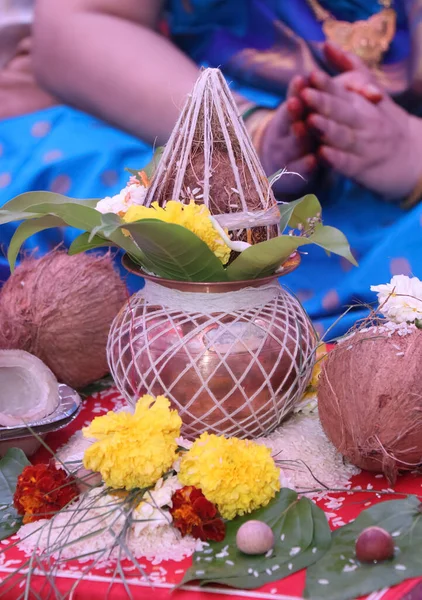 Performing Kalash puja rituals in Indian traditional wedding ceremony