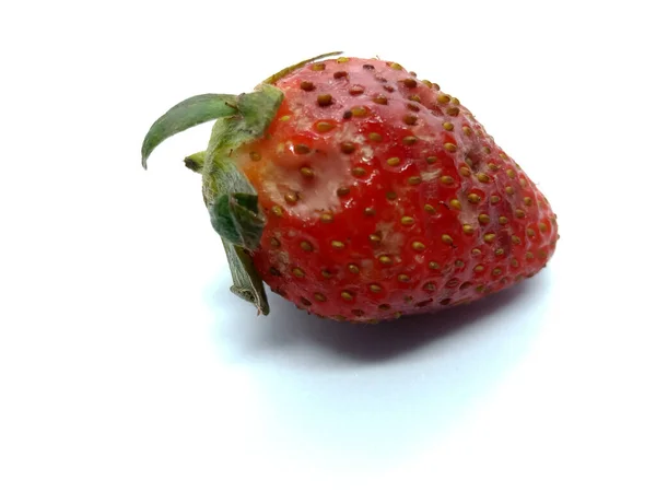 Spoiled strawberry fruit isolated 