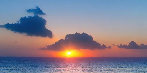 the sun is setting over the ocean with a cloud in the sky