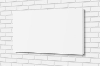 Beyaz tuğla duvardaki boş bez çerçeve