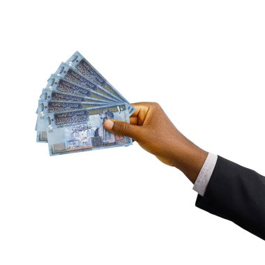 Üç boyutlu takım elbiseli siyah el, beyaz arka planda izole edilmiş Ürdün dinarı notaları.