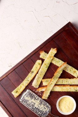 Peynirli parmesan peynirli Fransız ekmeği maydanoz kremalı İtalyan yemeği fotoğrafçılık arka plan sanat