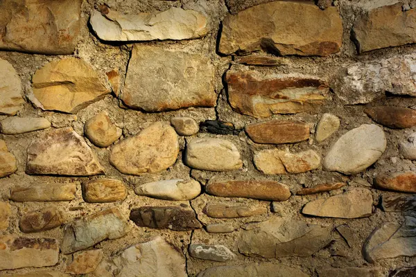 Stone wall background, old masonry wall stone texture. High quality photo
